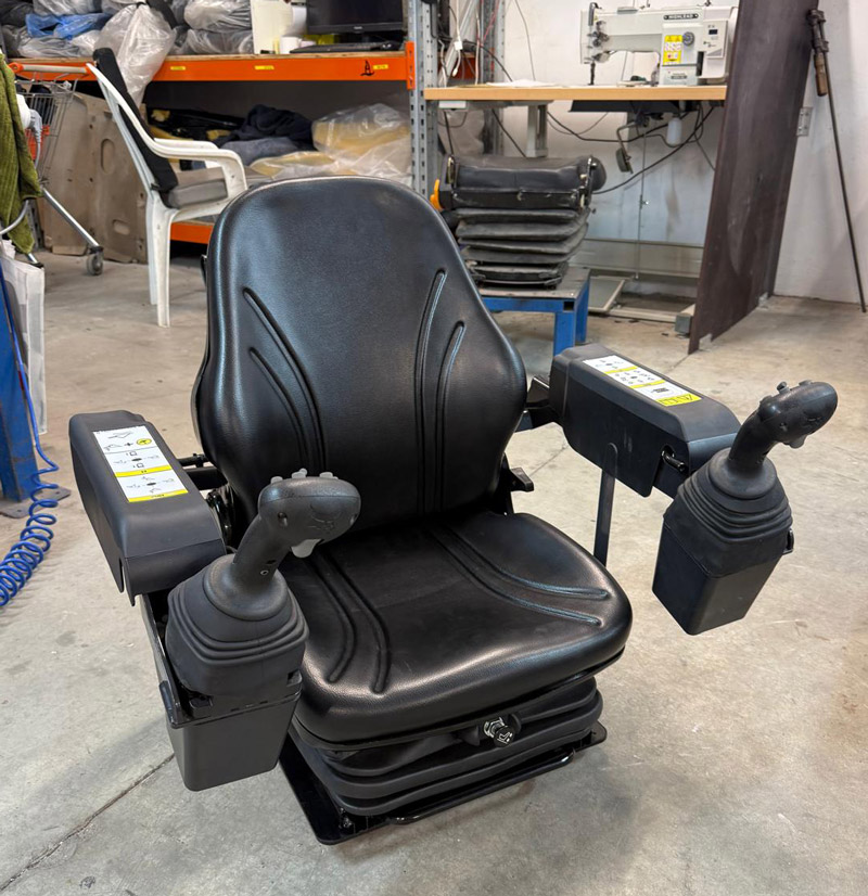 Low profile air seat solution for Bobcat 5650 skidsteer machine
