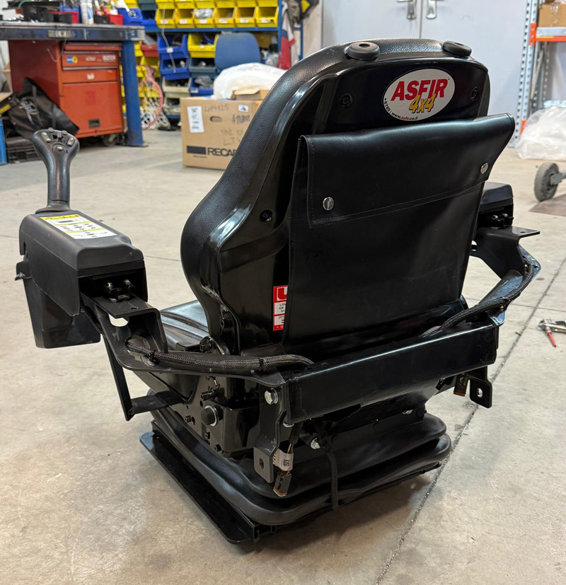 Low profile air seat solution for Bobcat 5650 skidsteer machine